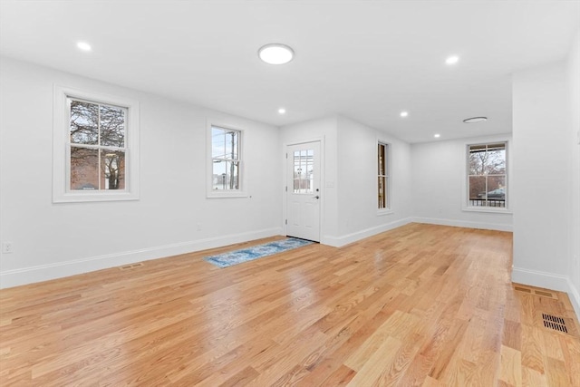 entryway featuring baseboards, recessed lighting, light wood-style floors, and visible vents