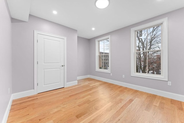 interior space featuring recessed lighting, baseboards, and light wood-type flooring