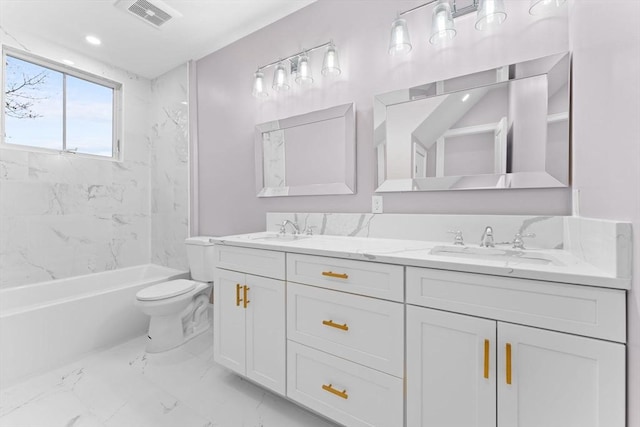 bathroom featuring toilet, visible vents, a sink, and marble finish floor