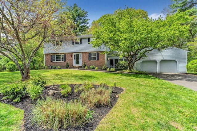 4 Fairway Rd, Acton, MA 01720 - colonial home with driveway, brick siding, and a front lawn