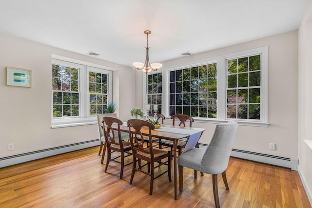 4 Fairway Rd, Acton, MA 01720 - dining room featuring baseboard heating, light wood-style flooring, and a chandelier