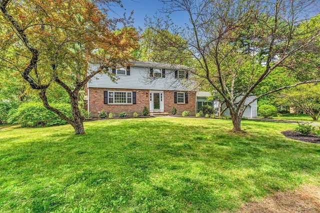 4 Fairway Rd, Acton, MA 01720 - colonial-style house featuring brick siding and a front yard