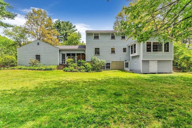 4 Fairway Rd, Acton, MA 01720 - rear view of house featuring a lawn