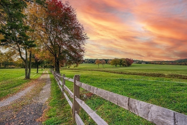 exterior space featuring a yard and a rural view