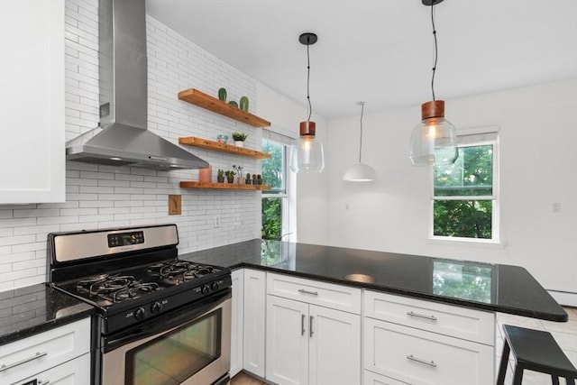 112 Thornton St Unit 2, Boston, MA 02119 - kitchen with stainless steel range with gas stovetop, wall chimney range hood, a peninsula, backsplash, and white cabinets