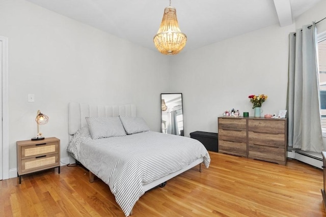 112 Thornton St Unit 2, Boston, MA 02119 - bedroom featuring a baseboard radiator, a chandelier, and wood finished floors