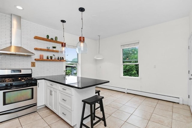 112 Thornton St Unit 2, Boston, MA 02119 - kitchen with stainless steel range with gas stovetop, wall chimney exhaust hood, white cabinets, light tile patterned floors, and a breakfast bar area