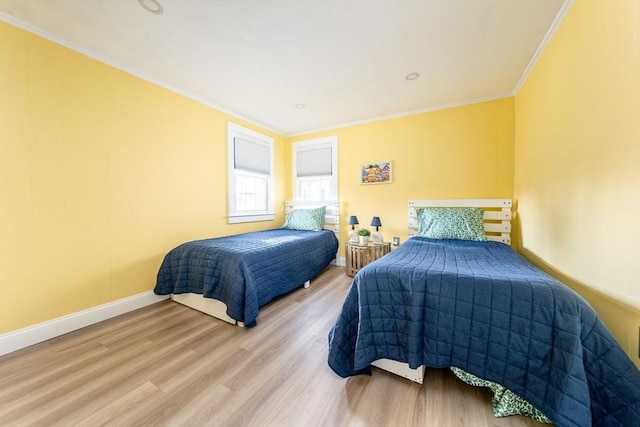 bedroom with crown molding and hardwood / wood-style flooring