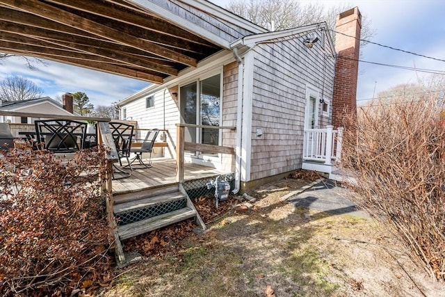 view of side of home featuring a gazebo and a deck