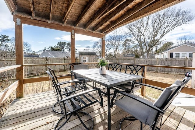 wooden terrace featuring a storage shed