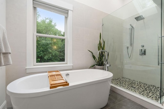 321-323 Lake Ave Unit 323, Newton, MA 02461 - full bath with tile walls, a shower stall, a freestanding bath, and tile patterned flooring