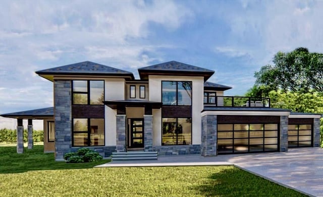 view of front of house with a balcony, a front yard, and a garage