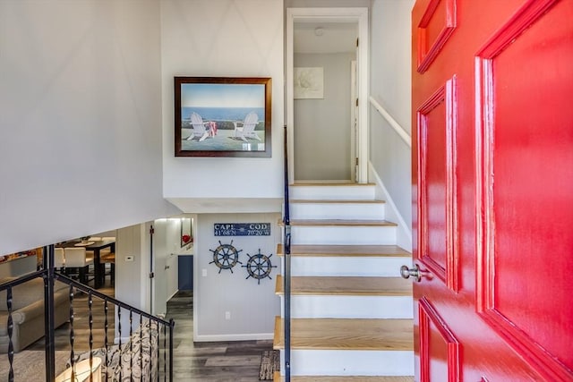 stairs featuring hardwood / wood-style flooring