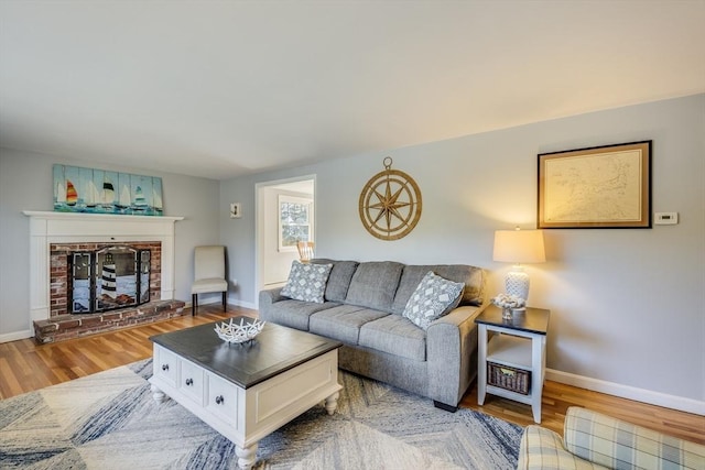 living room featuring hardwood / wood-style floors and a fireplace