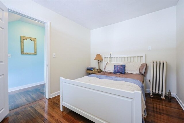 93 Bank St, North Attleboro, MA 02760 - bedroom with radiator, dark wood-style floors, and baseboards