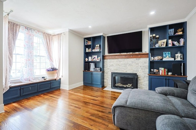 93 Bank St, North Attleboro, MA 02760 - living room featuring ornamental molding, wood finished floors, baseboards, a stone fireplace, and built in features