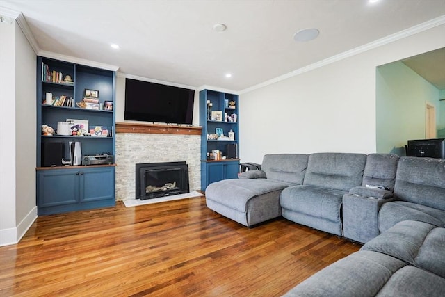 93 Bank St, North Attleboro, MA 02760 - living room with wood finished floors, a fireplace, ornamental molding, recessed lighting, and baseboards