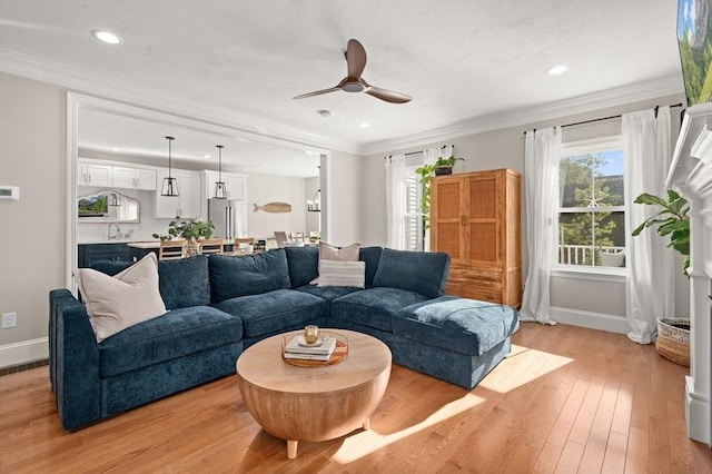 11 Bailey Pond Ln Unit 11, Amesbury, MA 01913 - living room featuring baseboards, a ceiling fan, crown molding, light wood-type flooring, and recessed lighting