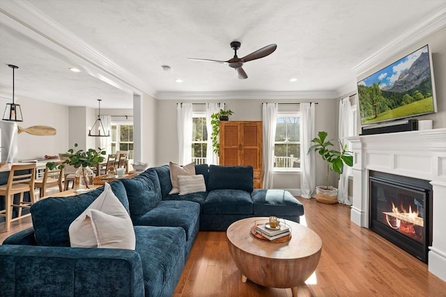 11 Bailey Pond Ln Unit 11, Amesbury, MA 01913 - living area featuring ceiling fan, light wood-type flooring, a glass covered fireplace, recessed lighting, and ornamental molding