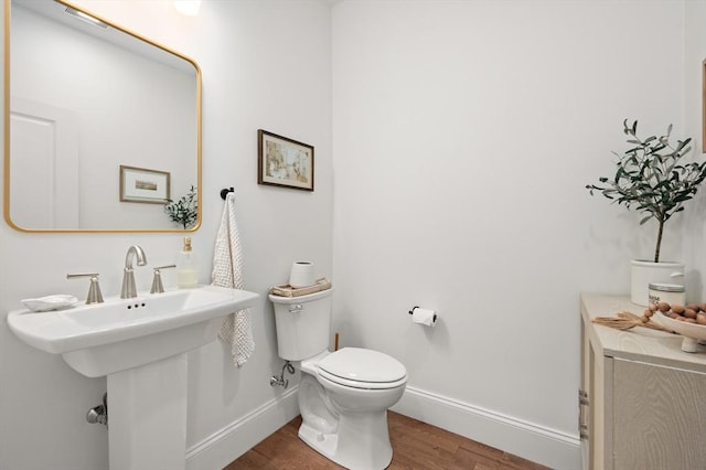 11 Bailey Pond Ln Unit 11, Amesbury, MA 01913 - bathroom with baseboards, wood finished floors, and toilet