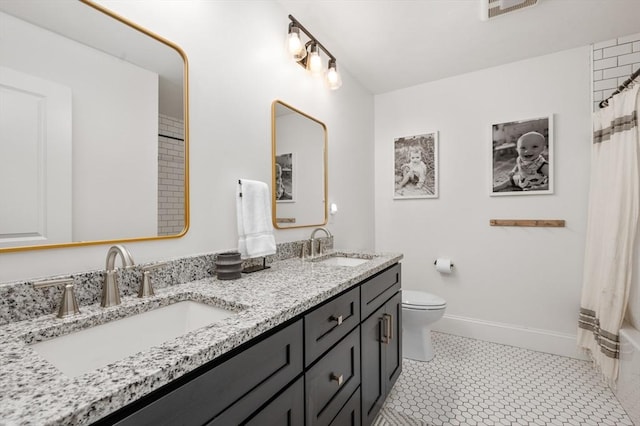 11 Bailey Pond Ln Unit 11, Amesbury, MA 01913 - full bath featuring double vanity, toilet, baseboards, and shower / bath combo with shower curtain