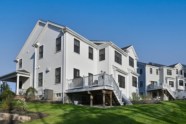 11 Bailey Pond Ln Unit 11, Amesbury, MA 01913 - back of house featuring stairs, a deck, and a lawn