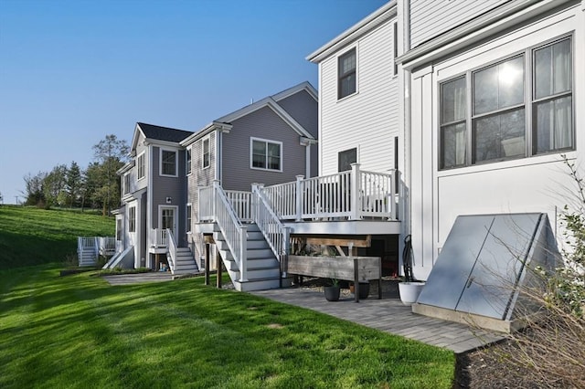 11 Bailey Pond Ln Unit 11, Amesbury, MA 01913 - back of house featuring a deck, stairs, and a yard