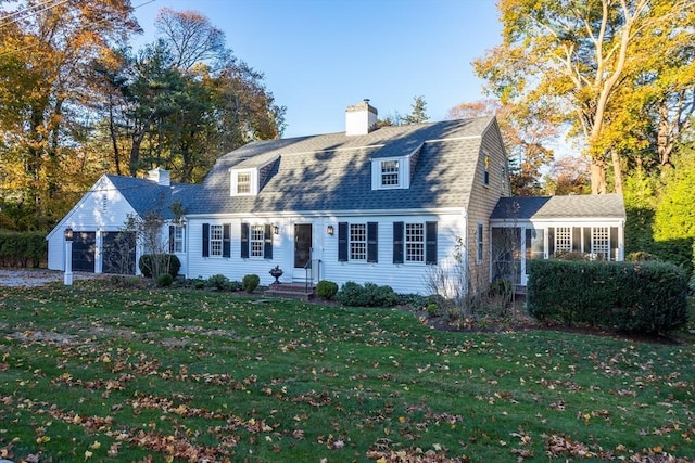 cape cod home with a front yard