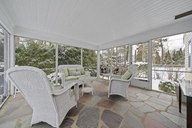 sunroom featuring wood ceiling