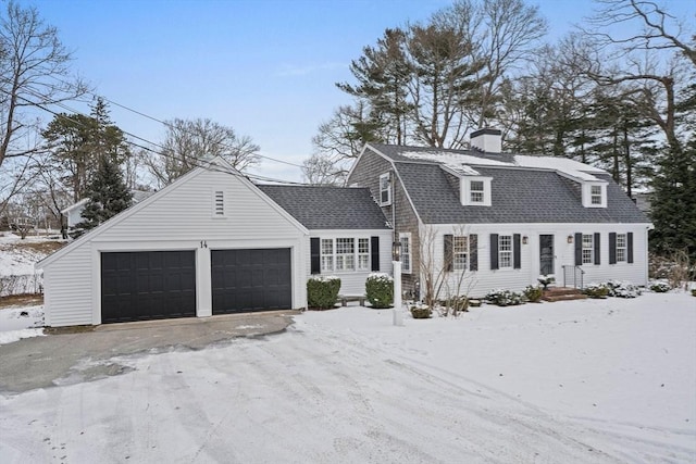 cape cod home with a garage