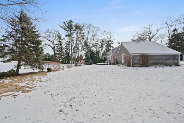 view of yard covered in snow