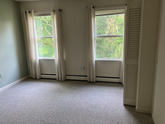 14 Harold St Unit D, Harwich, MA 02646 - empty room featuring plenty of natural light, carpet, and a baseboard radiator
