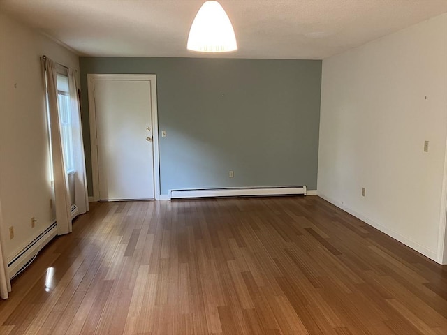 14 Harold St Unit D, Harwich, MA 02646 - empty room with baseboard heating and wood finished floors