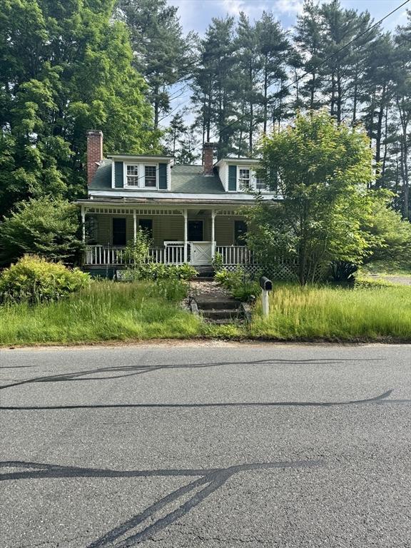 45 River St, Belchertown, MA 01007 - view of front of house featuring a porch and a chimney