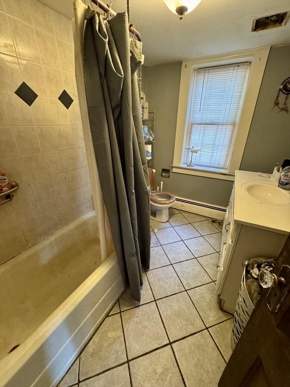 45 River St, Belchertown, MA 01007 - bathroom with tile patterned floors, a baseboard radiator, vanity, and shower / bath combination with curtain