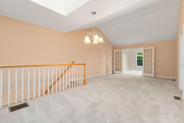 23 William Onthank Ln Unit 23, Southborough, MA 01772 - carpeted empty room with lofted ceiling, a chandelier, baseboards, and a skylight