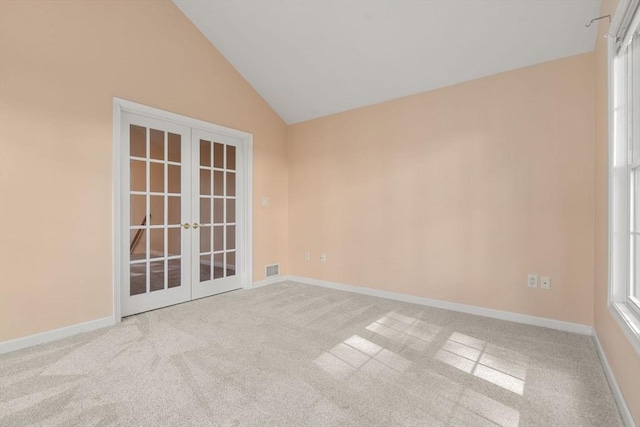 23 William Onthank Ln Unit 23, Southborough, MA 01772 - empty room featuring french doors, carpet floors, vaulted ceiling, and baseboards