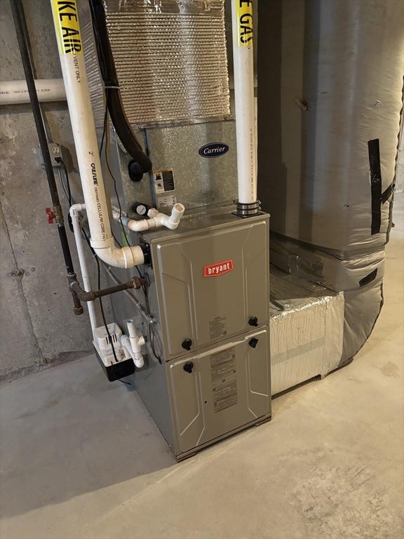 23 William Onthank Ln Unit 23, Southborough, MA 01772 - utility room featuring heating unit