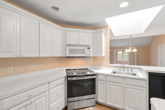 23 William Onthank Ln Unit 23, Southborough, MA 01772 - kitchen featuring stainless steel range with electric stovetop, white microwave, black dishwasher, a sink, and a chandelier