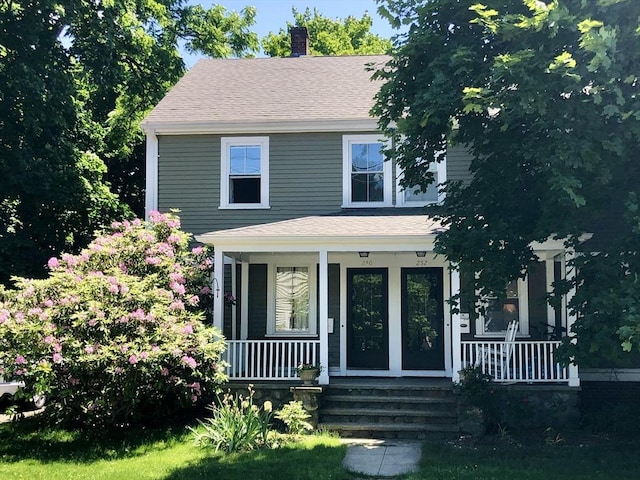 250 Arlington St Unit A, Acton, MA 01720 - american foursquare style home with a porch, a chimney, and roof with shingles