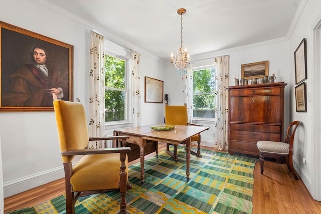 250 Arlington St Unit A, Acton, MA 01720 - living area featuring wood finished floors, a chandelier, ornamental molding, and baseboards