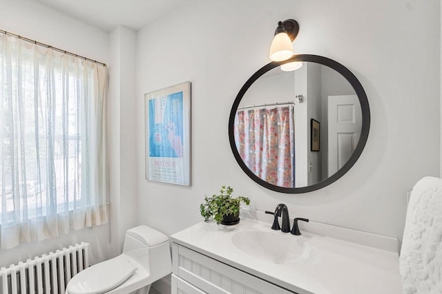 250 Arlington St Unit A, Acton, MA 01720 - full bathroom featuring radiator heating unit, healthy amount of natural light, vanity, and toilet
