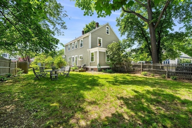 250 Arlington St Unit A, Acton, MA 01720 - rear view of house with a chimney