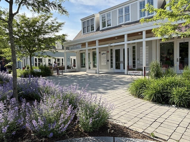 250 Arlington St Unit A, Acton, MA 01720 - rear view of property featuring french doors