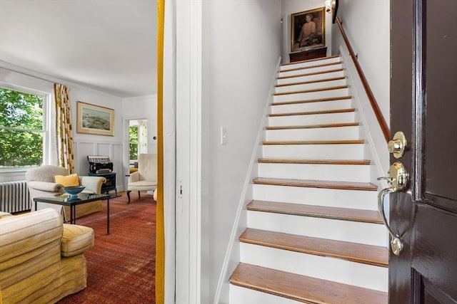 250 Arlington St Unit A, Acton, MA 01720 - stairway with radiator heating unit, carpet flooring, and ornamental molding