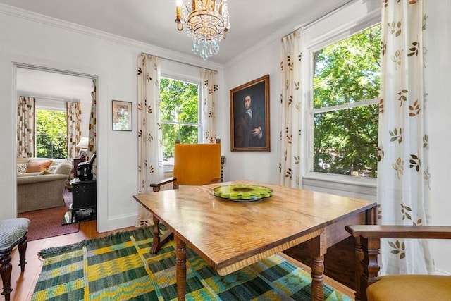 250 Arlington St Unit A, Acton, MA 01720 - dining area featuring a chandelier, ornamental molding, and dark wood finished floors