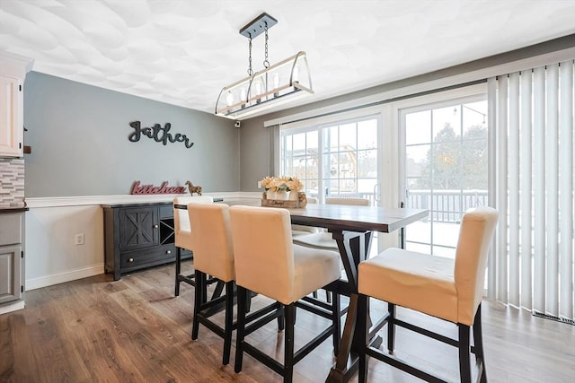 dining room with light hardwood / wood-style floors