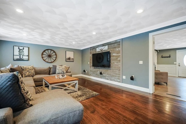 living room with crown molding and hardwood / wood-style floors