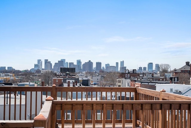 437-439 Chelsea St Unit 3R, Boston, MA 02128 - wooden terrace with a view of skyline