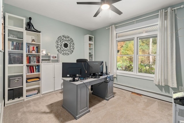 office with baseboard heating, light carpet, and ceiling fan